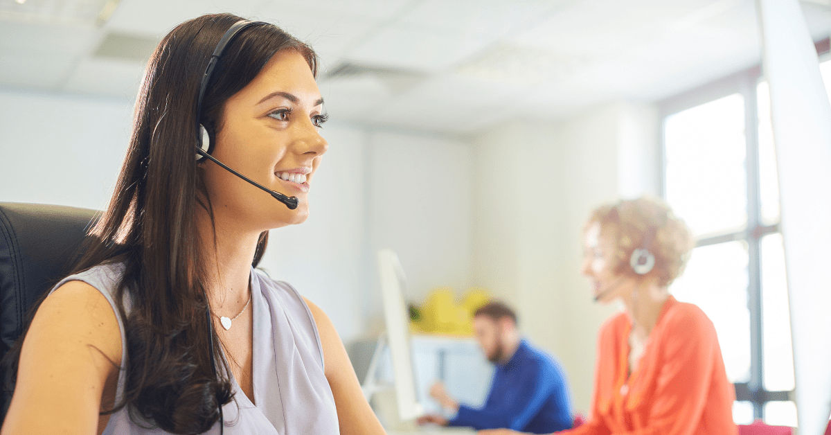 Woman wearing a headset in a contact centre